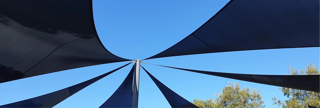 A Large Black Canopy Providing Shade In An Outdoor Setting